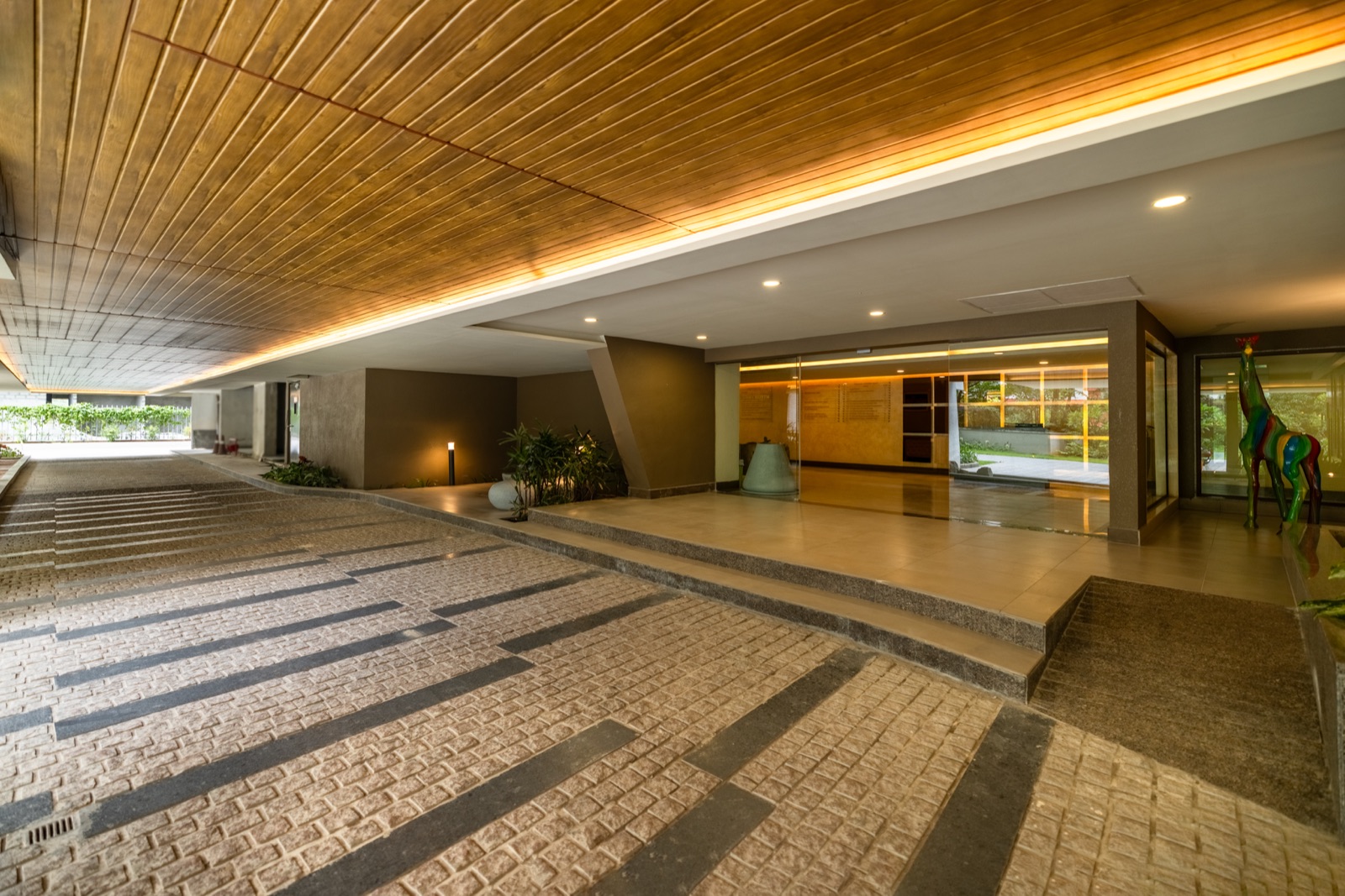 La Palazzo entrance with timber detailing and landscaping